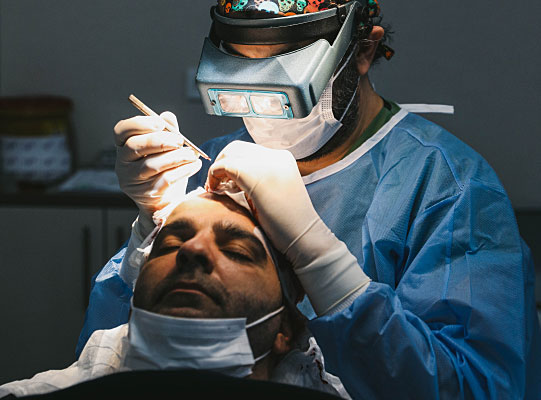 Dr Cink is doing a Hair Transplant on a patient in his clinic in Istanbul Turkey